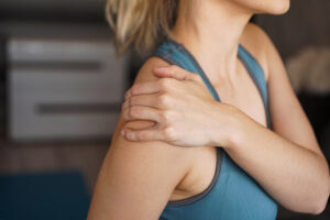 Close-up of woman with painful shoulder